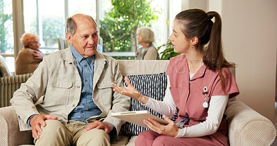 Buy stock photo Senior, man and discussion with nurse in retirement home for healthcare, routine or schedule. Woman, caregiver or male person on sofa for elderly foster care or planning checklist in old age house
