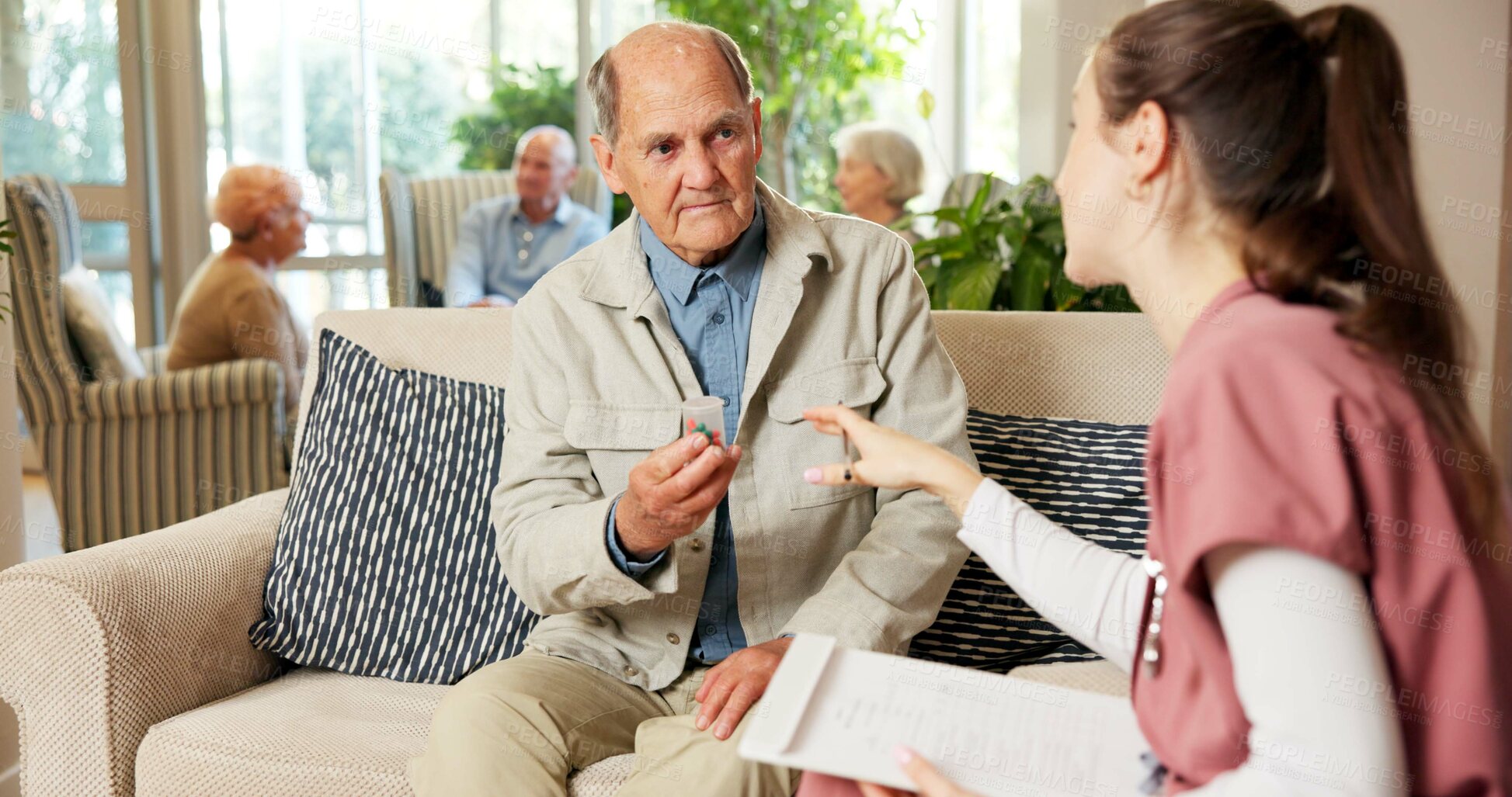 Buy stock photo Elderly, man and nurse with pills in retirement home for medication or pharmaceutical advice. Senior, male person or caregiver talking to patient with tablets for medical help, cure or treatment