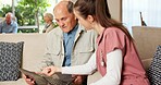 Senior, woman or nurse with laptop on sofa for online healthcare, help or guidance in retirement home. Elderly, female person or assistance with man on computer for Telehealth app, web or connection