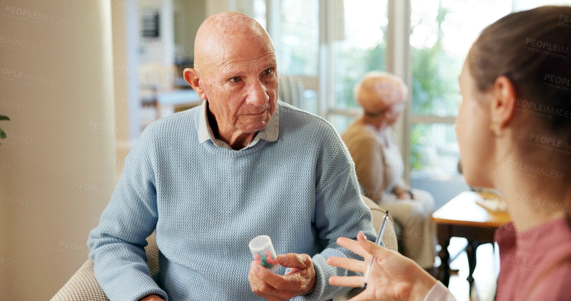 Buy stock photo Elderly, man or nurse with pills for medication, pharmaceutical advice or help in retirement house. Senior, female person or discussion with patient or tablets for medical treatment in nursing home