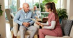 Senior, man and nurse with checklist in retirement home for healthcare, routine or schedule. Caregiver, male person or discussion with support for agenda, activities or wellness in old age house
