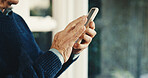 Texting, phone and hands of old man in home for retirement fund app, contact and connection. Pension portfolio tracking, communication and space with senior person and mobile for policy update
