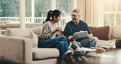 Buy stock photo Tablet, coffee and couple on sofa in home with planning budget, savings or finance research. Warm beverage, digital technology and man with woman in living room for discussion on app for investment.
