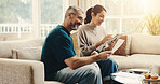 Tablet, paperwork and couple on sofa in home with planning budget, savings or finance research. Documents, digital technology and mature man with woman in living room for discussion for investment.