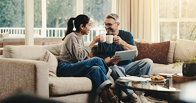 Buy stock photo Tablet, cheers and couple with coffee on sofa in home with planning budget, savings or finance research. Happy, digital technology and man with woman in living room for discussion for investment.