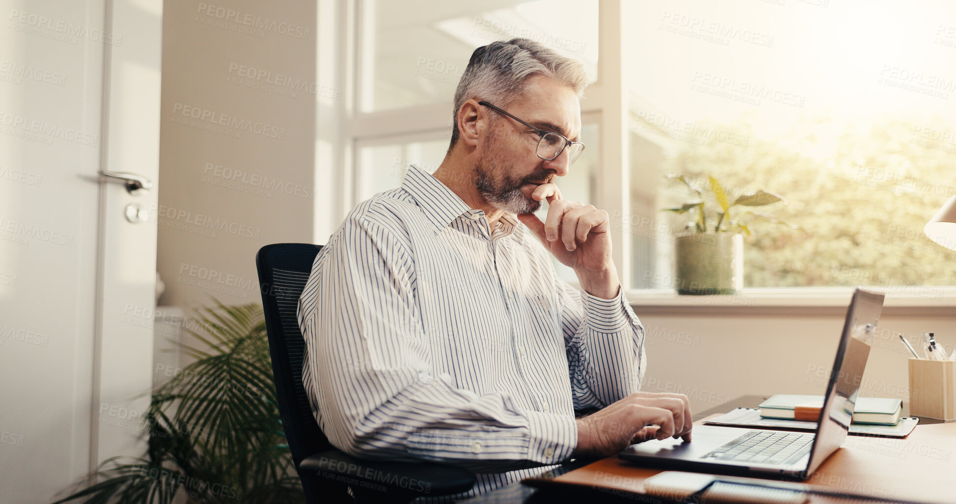 Buy stock photo Reading, online and businessman with laptop in office, accountant or plan for taxes with information. Bookkeeper, budget review and mature person with tech, audit and financial report in business