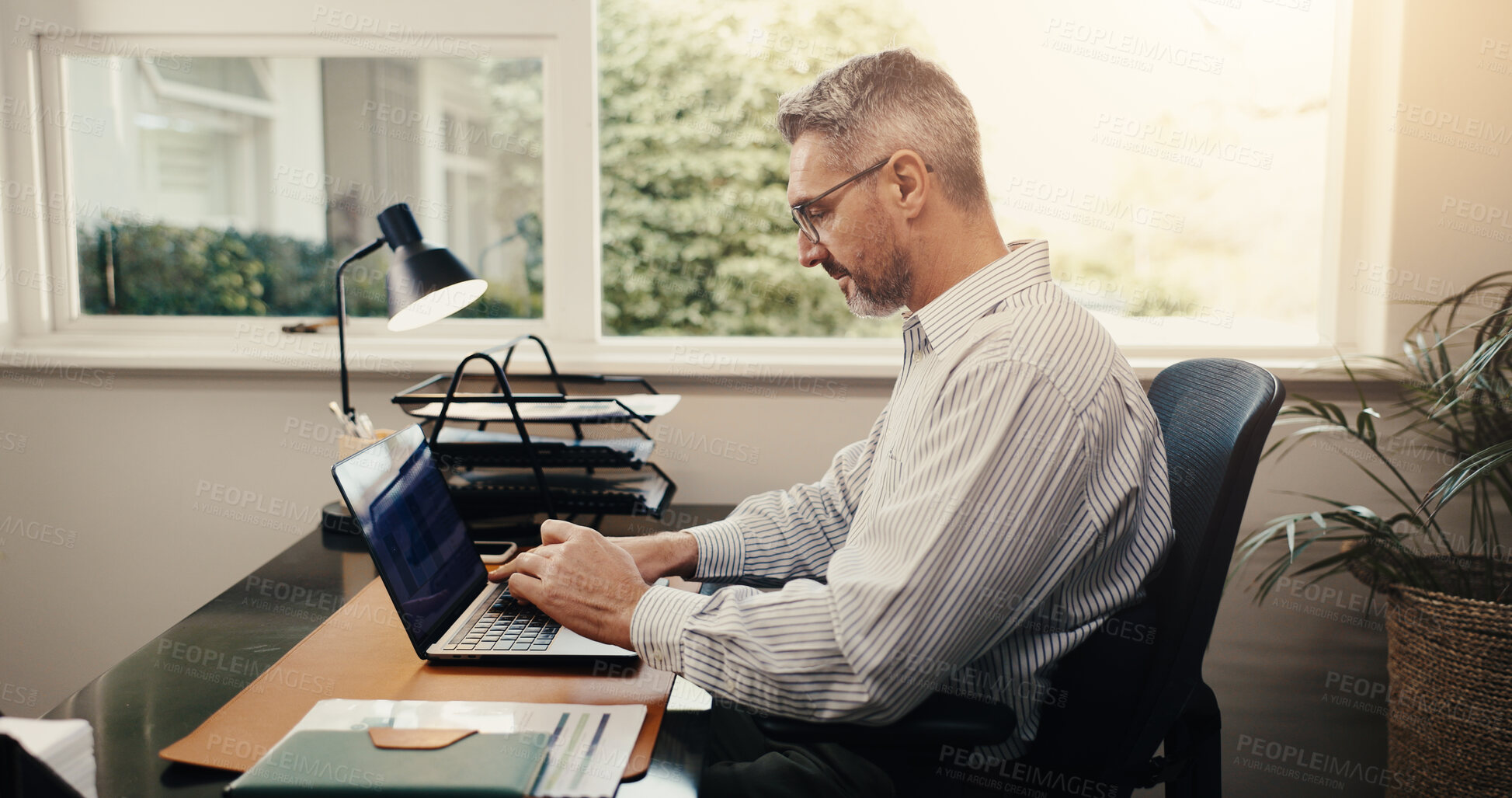 Buy stock photo Budget review, online and businessman with laptop in office, accountant or tax preparation with info. Bookkeeper, typing and mature person with technology, audit and financial report in business