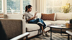 Woman, relax and coffee with phone in house for social media, browsing website and texting contact. Break, mature person and mobile with herbal drink, online notification and chat with message update