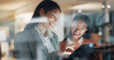 Buy stock photo Business, people and laugh in office with tablet, proofreading and night for story submission. Smile, women and team working late in workplace with digital, copywriting report and article deadline
