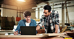 Carpenter, team and men with laptop in factory, furniture production or helping intern with research. Carpentry, mentor and people with tech, manufacturing and collaboration for project in workshop