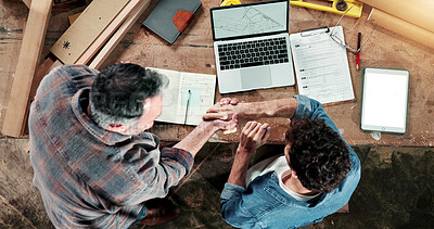 Buy stock photo Man, carpenter or laptop with handshake for woodwork, timber construction or building deal. Top view, male people or employees shaking hands with computer for carpentry project, design or partnership