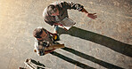 Men, carpenter or discussion with building inspector for distribution planning, inventory or storage. Top view, male people or employee with checklist for freight safety or inspection in warehouse