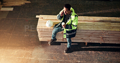 Buy stock photo Carpenter, phone call and man with coffee in workshop, talk and order update with timber supplier. Woodwork, drink and person with tech for conversation, inventory or break in warehouse with top view