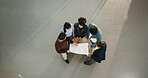 People, architect and team with blueprint on space for construction project or building development. Top view, group or civil engineer with document for structure planning or architecture design