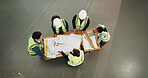 Architect, team or meeting with blueprint for construction planning, brainstorming or discussion. Top view, people or collaboration with documents or floor layout for building project or architecture