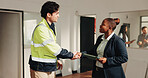 Engineer, tablet and handshake in building with inspector, compliance success or renovation approval. Happy, people and shaking hands with commercial property manager, tech and engineering project.