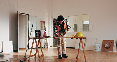 Buy stock photo Construction, tablet and man in office with blueprint, planning and drawing for building design. Architecture, contractor and person at desk with tech, writing and remodeling layout for renovation