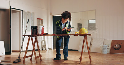 Buy stock photo Construction, tablet and woman in building with blueprint, planning and drawing for structure design. Architecture, contractor and person at desk with tech, sketch or remodeling layout for renovation