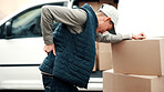 Back pain, boxes and delivery man outdoor for courier transport, shipping and distribution. Burnout, person and cargo parcel by van with muscle fatigue, heavy lifting or strain at package drop off