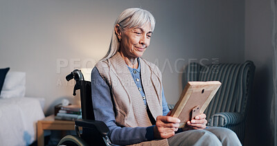 Buy stock photo Smile, photo frame old woman in wheelchair with memories, nostalgia and reminisce in retirement home. Picture, happy and elderly person with disability in bedroom, reminder and looking at souvenir