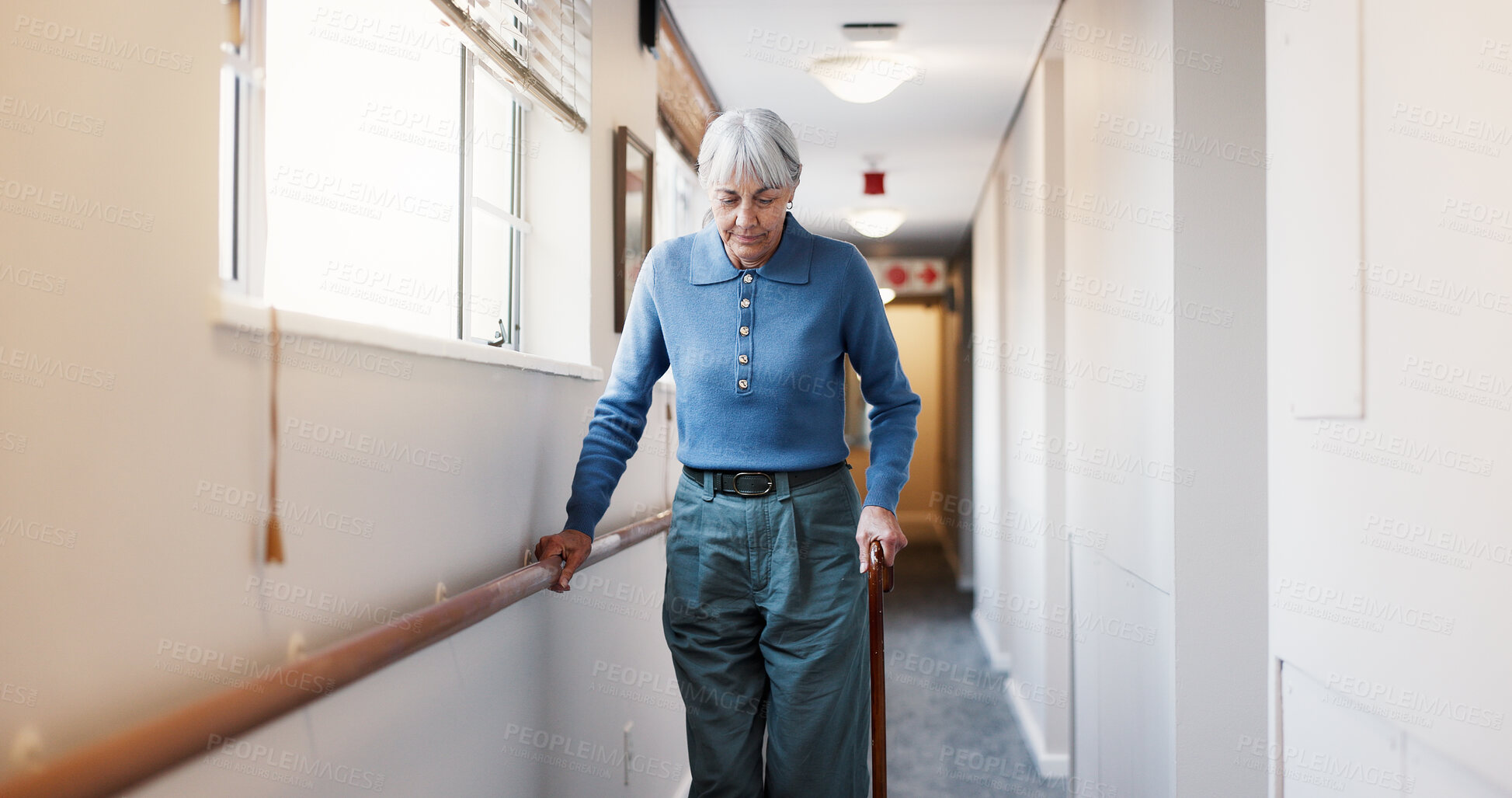 Buy stock photo Old woman, walking and physio at facility with walker, support and mobility aid for injury recovery. Medical, corridor and senior person with disability, gait assistance and balance for physiotherapy