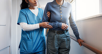 Buy stock photo Hands, caregiver and walk at facility with old woman, support and mobility aid for injury recovery. Nurse, helping or person with disability, gait training and balance assistance for physical therapy
