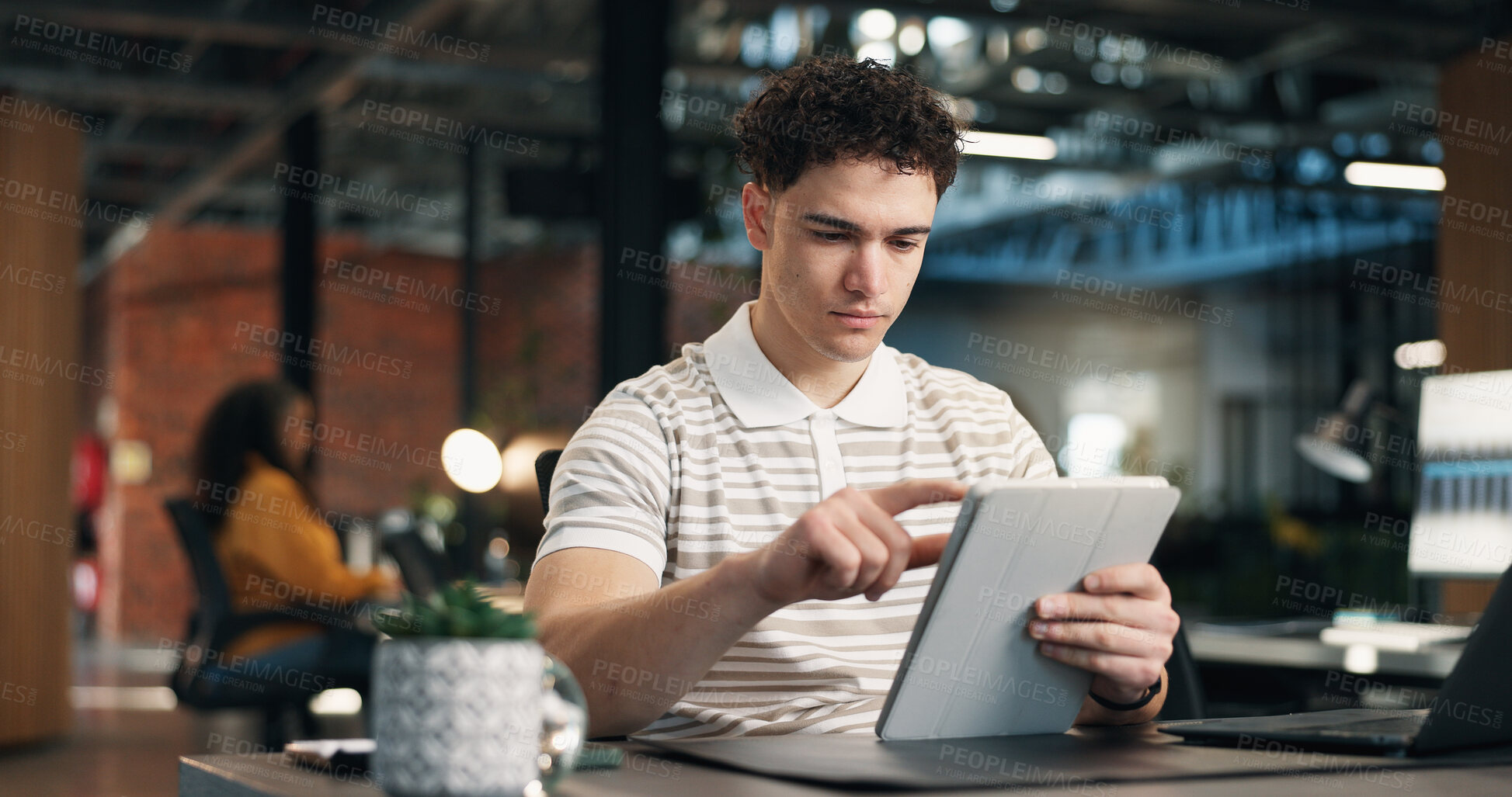 Buy stock photo Creative, scroll and man with tablet in office, serious and planning for article or research on app. Business, blogger and person with technology, reading and editing blog post on web and browsing