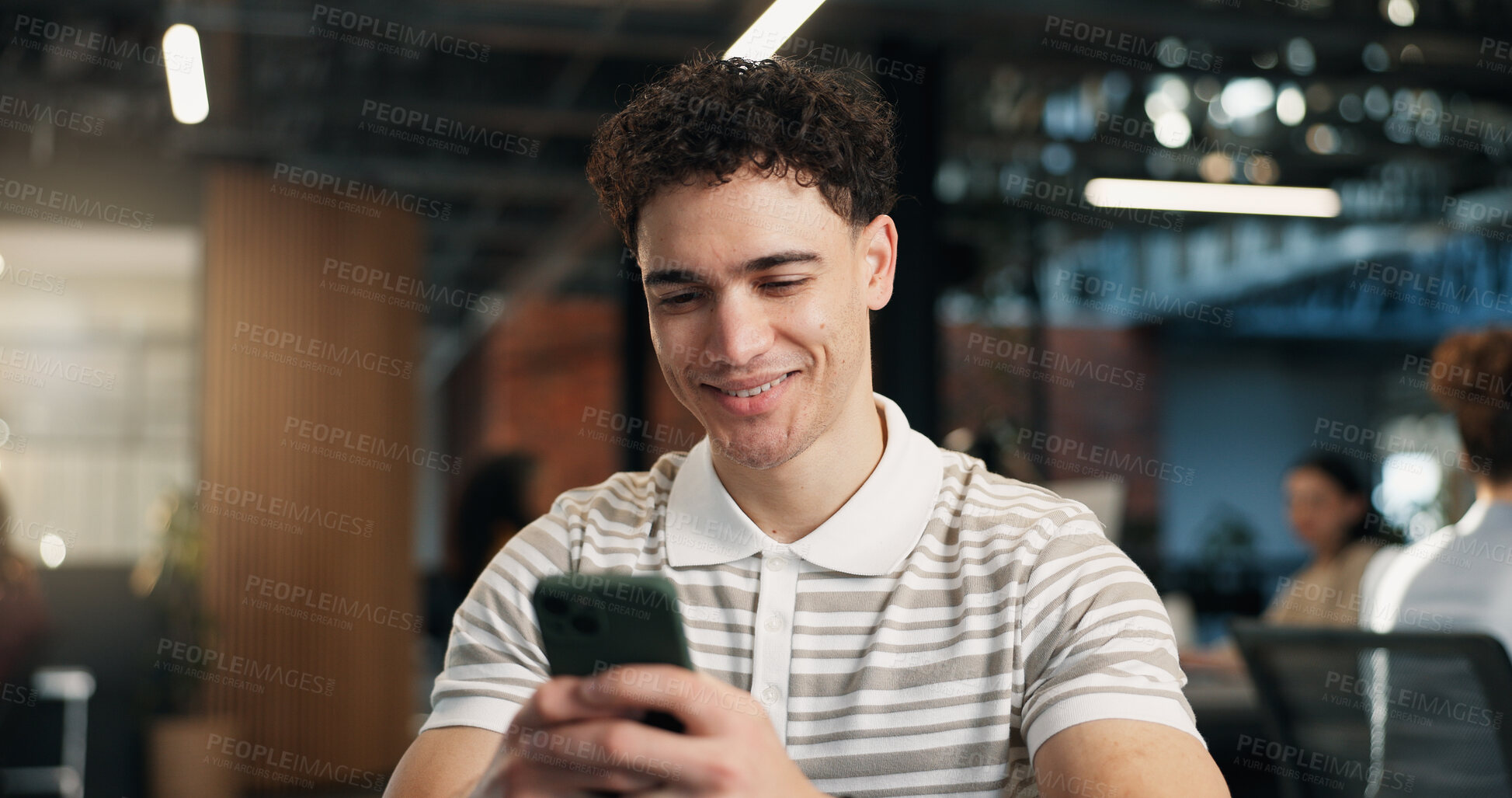 Buy stock photo Happy, man and email in office with phone, text message notification and good news for work project. Bokeh, coworking and person in business with digital tech, smile and positive feedback for job.