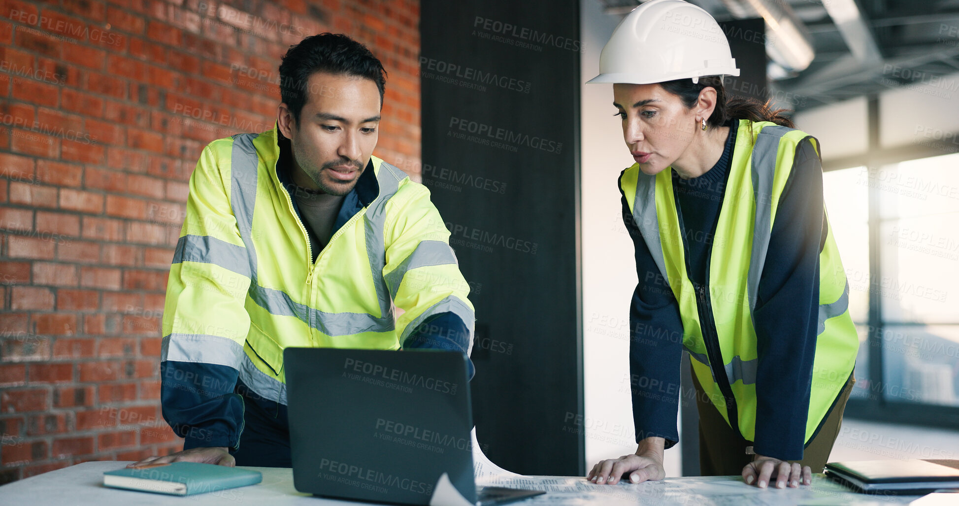 Buy stock photo Architect, team and planning in building with laptop, review design and blueprint for project. People, collaboration and discussion with tech for architecture research, brainstorming and partnership