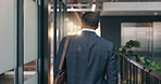 Back, businessman and arrival at office with bag, real estate agent career and beginning of work day. Realtor, male person and walk in agency for property development meeting, employment or ambition.
