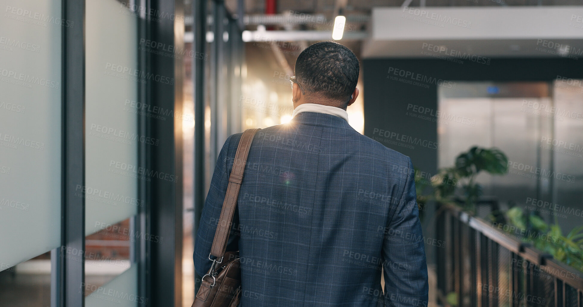 Buy stock photo Back, businessman and arrival at office with bag, real estate agent career and beginning of work day. Realtor, male person and walk in agency for property development meeting, employment or ambition.