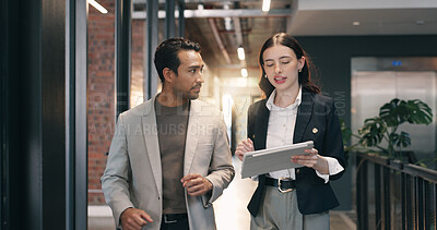 Buy stock photo Walking, corridor and business people on tablet for talking, meeting or update for finance review. Office, team and man with woman on tech for online report, financial proposal or investment planning