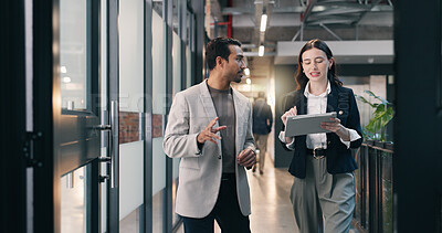 Buy stock photo Walking, hallway and business people on tablet for talking, meeting and update for finance review. Office, team and man with woman on tech for online report, financial proposal or planning for budget