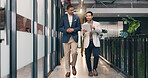 Walking, hallway and business men on tablet for talking, meeting and update for finance review. Office, team and people on tech for online report, financial proposal and discussion for investment