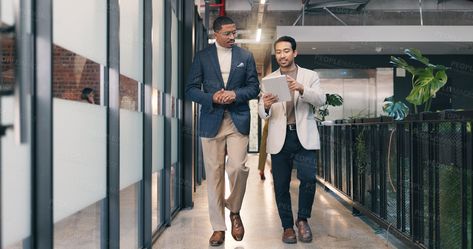 Buy stock photo Walking, hallway and business men on tablet for talking, meeting and update for finance review. Office, team and people on tech for online report, financial proposal and discussion for investment