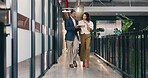 Walking, hallway and business people on tablet for meeting, discussion and update for finance review. Office, team and man with woman on tech for online report, financial proposal and budget planning