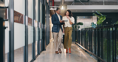 Buy stock photo Walking, hallway and business people on tablet for meeting, discussion and update for finance review. Office, team and man with woman on tech for online report, financial proposal and budget planning