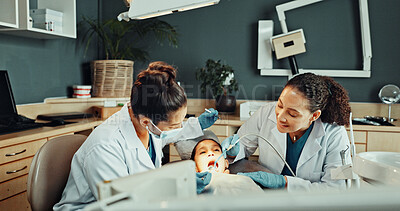 Buy stock photo Assistant, tools and dentist with child in clinic for teeth cleaning, assessment or checkup. Oral hygiene, suction and orthodontic team with kid for tooth extraction for dental health at consultation