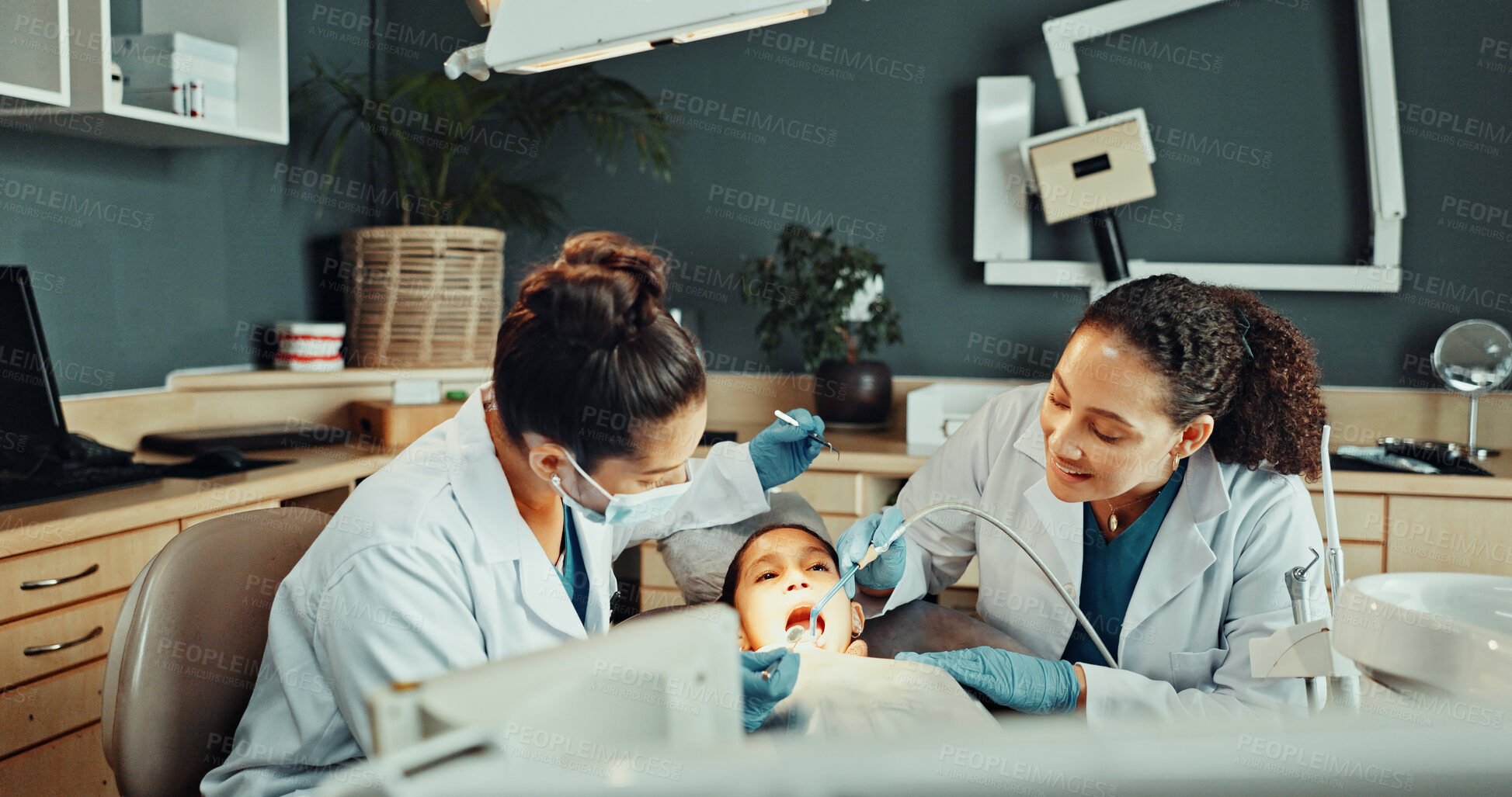 Buy stock photo Assistant, tools and dentist with child in clinic for teeth cleaning, assessment or checkup. Oral hygiene, suction and orthodontic team with kid for tooth extraction for dental health at consultation