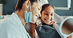 Dentist, teeth or happy girl with mirror in clinic for dental hygiene, oral healthcare or results. Orthodontist, child or kid with smile or reflection for gum care satisfaction, cleaning or treatment