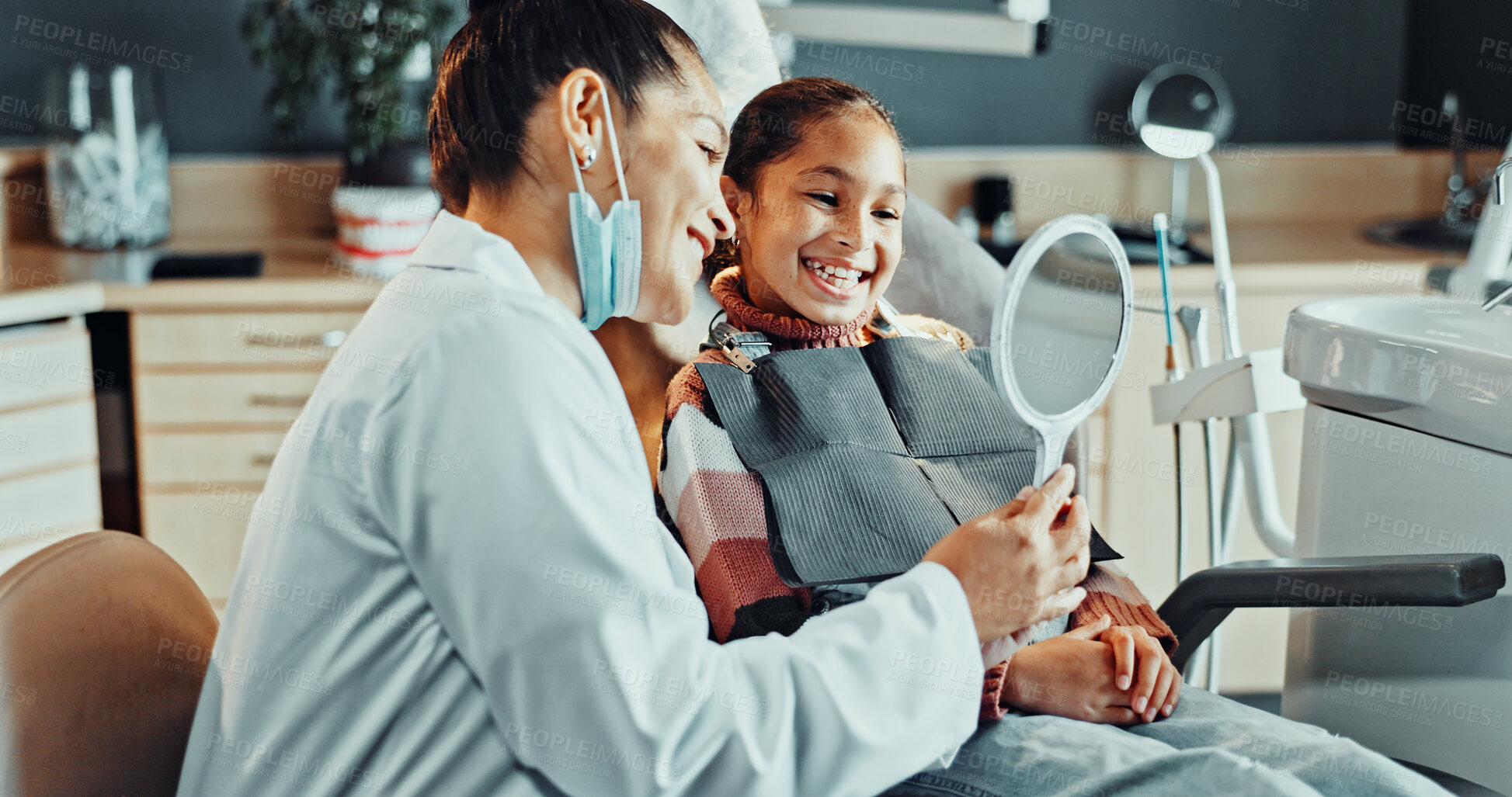 Buy stock photo Mirror, dentist and kid in clinic for teeth cleaning, service or oral hygiene for wellness. Happy, orthodontist and girl child with consultation for braces, dental care or gum health in office.