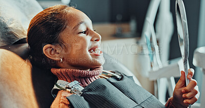 Buy stock photo Mirror, dentistry and child patient in clinic for teeth cleaning, service or oral hygiene for wellness. Happy, orthodontist and girl kid with consultation for braces, dental care or gum health.