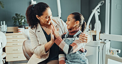 Buy stock photo Happy, mother and child in dentist office with high five, support and well done for oral procedure. Woman, daughter and celebration in clinic with smile, orthodontics or good job for dental treatment