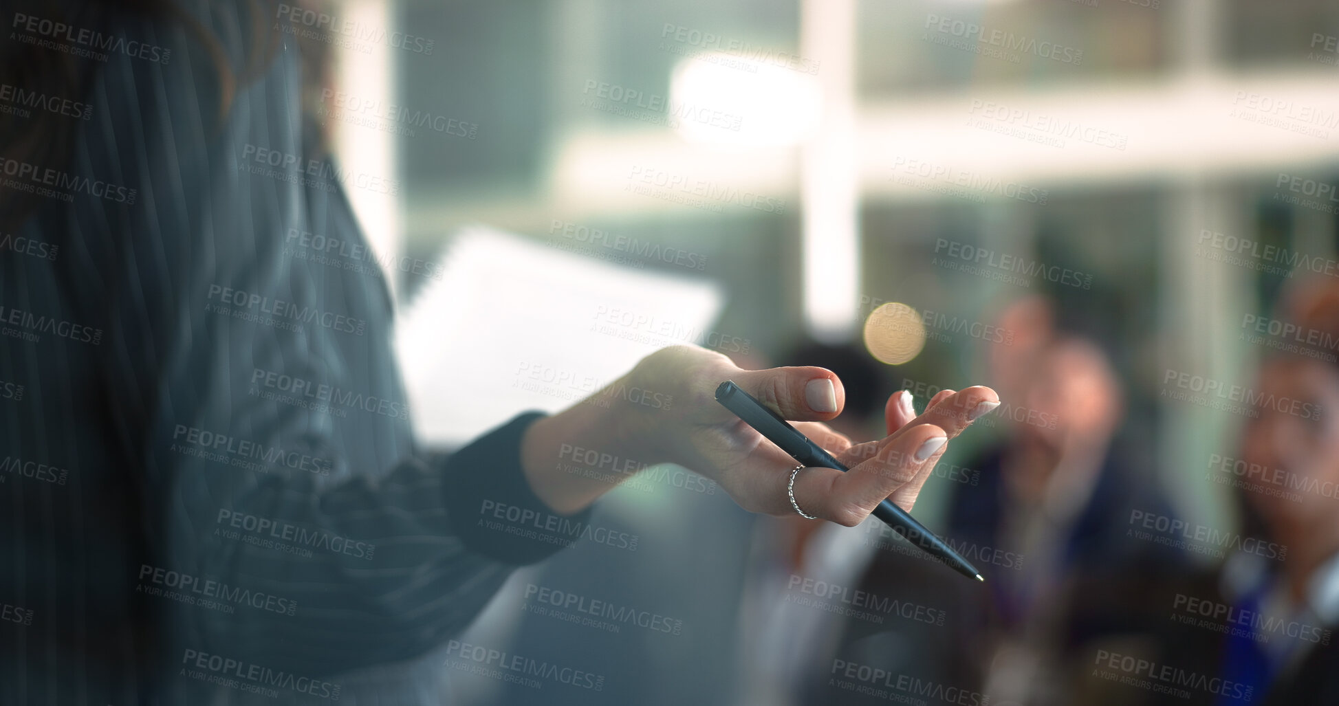 Buy stock photo Hands, speaker or presenting to crowd in workshop for finance expo, knowledge or career development. Pen, woman and document for keynote address, industry trends or financial literacy at global event