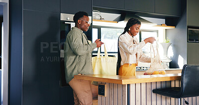 Buy stock photo Unpacking, groceries and couple with smile in kitchen, black man or woman with healthy food in home. Happy people, bonding and shopping bags with fruit, love and relationship commitment in house