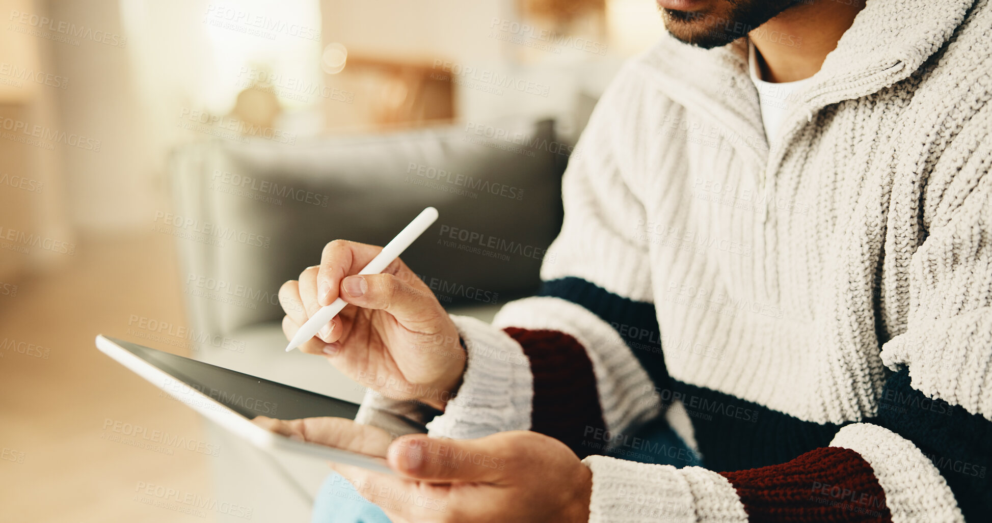 Buy stock photo Hands, tablet and man with pen on sofa for remote work, web design and research for project. Freelancer, home and person with tech, stylus and internet for digital ui, planning and website content
