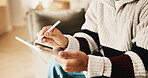 Hands, tablet and man with stylus in home for remote work, web design and research for project. Freelancer, sofa and person with tech, pen and internet for digital ui, planning and website content