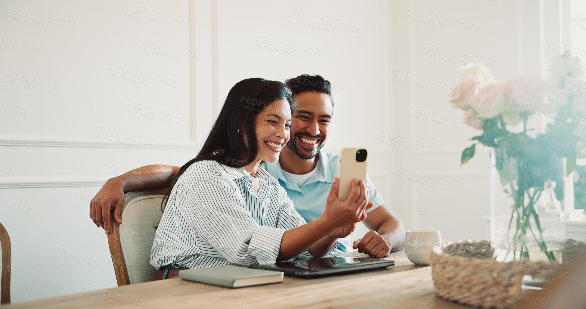 Buy stock photo Video call, happy and couple with phone in home for communication, bonding and networking. Smile, technology and man with woman on cellphone for virtual conversation in house together on weekend.