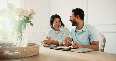 Buy stock photo Coffee, conversation and couple by table in home for bonding, love and connection in marriage. Happy, warm beverage and man with woman for discussion on relationship commitment in house on weekend.