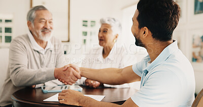 Buy stock photo Old couple, handshake and financial advisor with smile, house and laugh with investment opportunity. Happy, senior people and asset management with wealth manager, shaking hands and pension in home